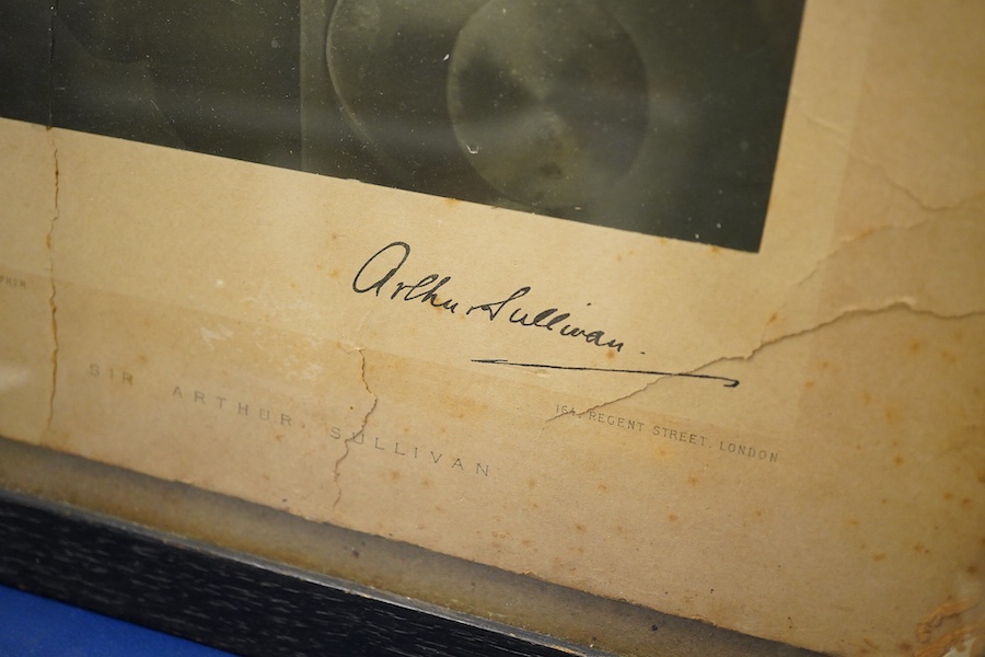 A Gilbert and Sullivan Opera model theatre, with printed card figures from the Mikado, together with a portrait photograph of Sir Arthur Sullivan loosely contained within a stained wood frame, the photograph is unmounted